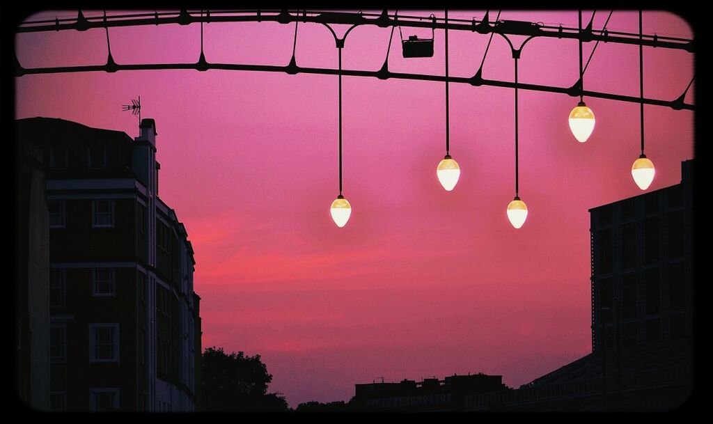 architecture, built structure, low angle view, building exterior, illuminated, lighting equipment, street light, building, sky, city, night, electricity, electric light, no people, dusk, orange color, hanging, residential building, auto post production filter, residential structure