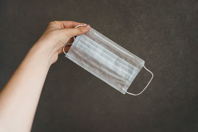 Close-up of woman hand holding paper