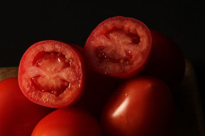 Close-up of red fruits against black background