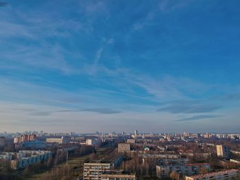 High angle view of townscape against blue sky