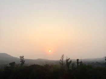 Scenic view of landscape against sky during sunset