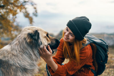 Rear view of woman with dog