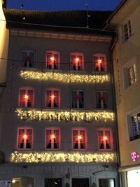 Low angle view of illuminated building at night