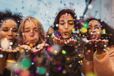 Portrait of happy girl with bubbles in background