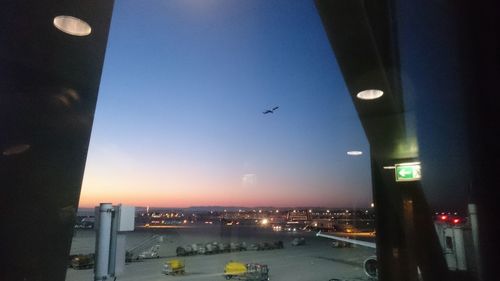 Airplane flying over city at night