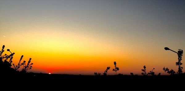 Scenic view of silhouette landscape at sunset