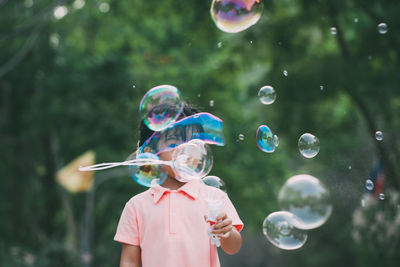 Full length of bubbles in mid-air