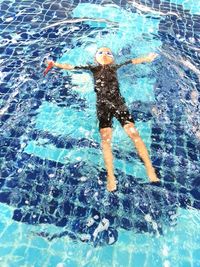 High angle view of man swimming in pool