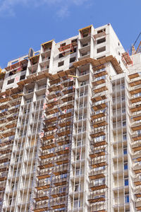 Low angle view of building against blue sky