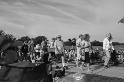 People at town square against sky