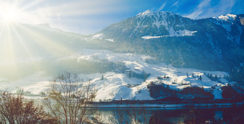 Panoramic shot of snowcapped mountains against sky