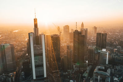 Incredible view of frankfurt am main, germany skyline in on hazy winter morning in beautiful sunrise light