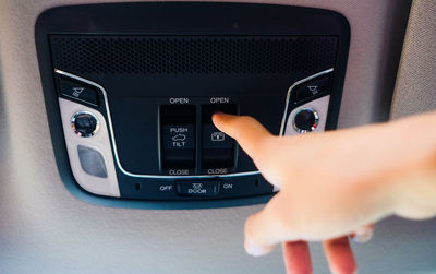 Close-up of hand push car sunroof 