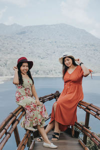 Young pretty asian women feeling relax with ocean and mountain view in wanagiri, bali. 