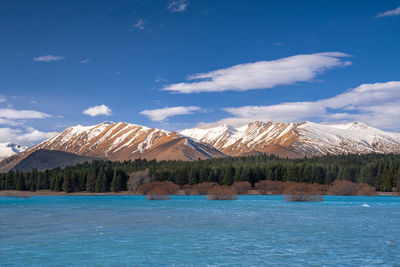 Beautiful mountain range at the turquoise color lake tekapo