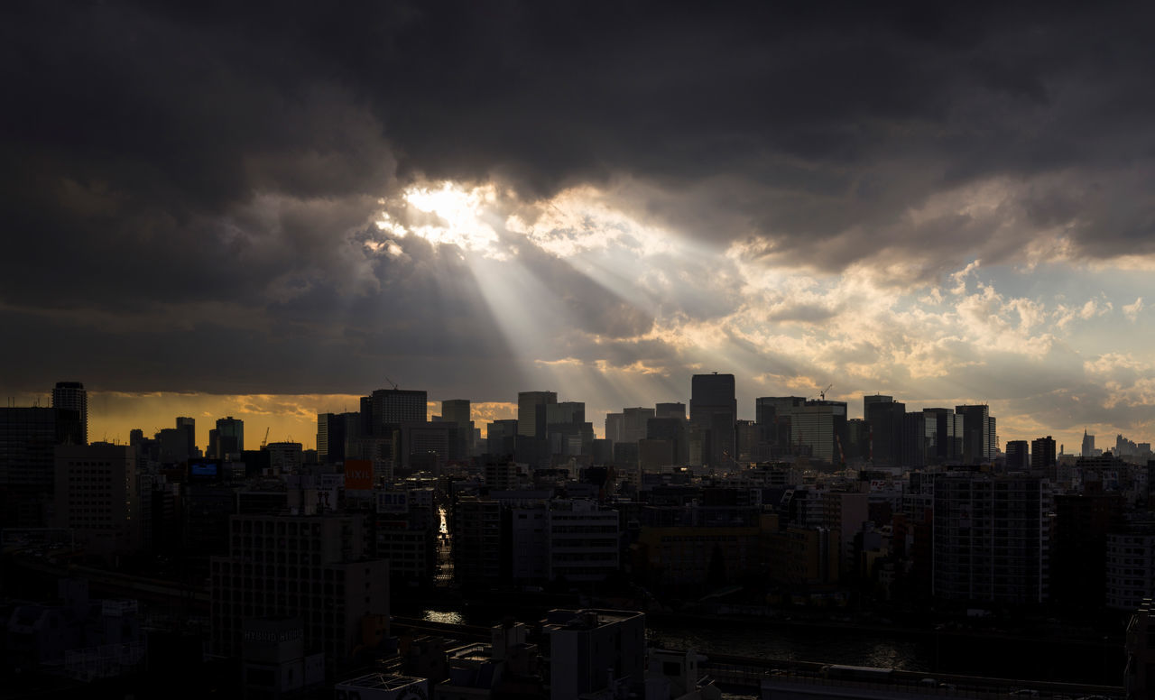 VIEW OF CITY AGAINST CLOUDY SKY