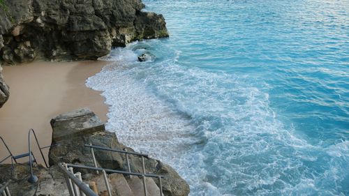 High angle view of rocks by sea