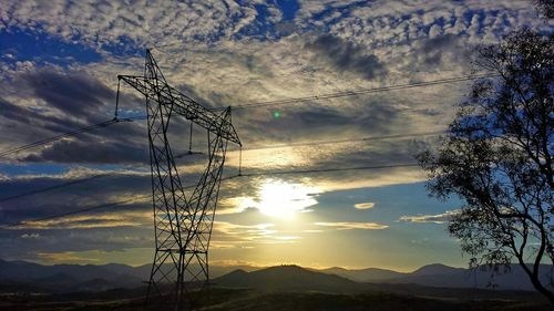 Electricity pylon at sunset