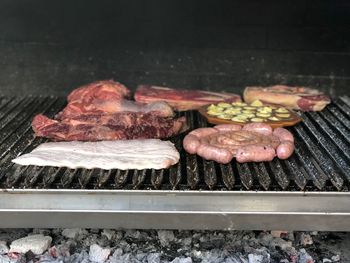 Close-up of meat on asado