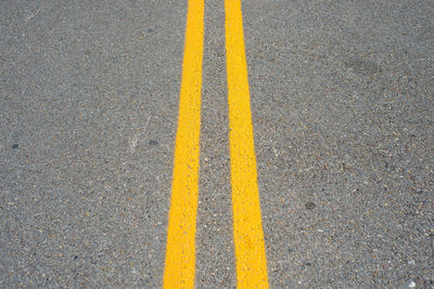 High angle view of yellow zebra crossing on road