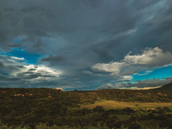 Scenic view of dramatic sky over land