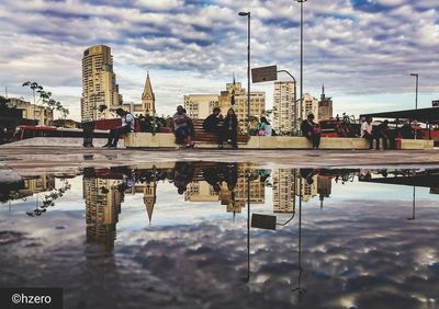 Reflection of buildings in puddle