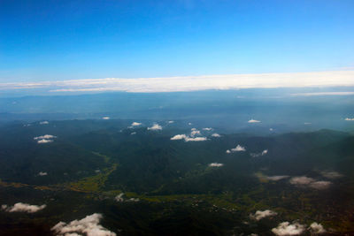 High angle view of landscape against blue sky