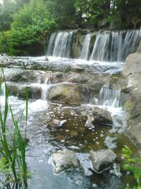 Stream flowing through rocks in forest