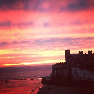 Scenic view of sea against romantic sky