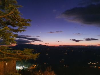 Scenic view of silhouette landscape against sky at sunset