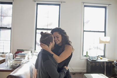 Young couple sitting on floor