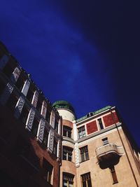 Low angle view of building against cloudy sky