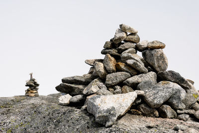 Close-up of stack of rocks against clear sky