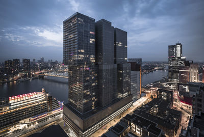 Aerial view of modern buildings against sky in city
