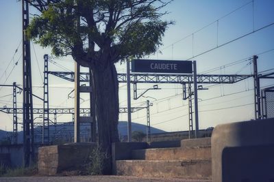 Low angle view of road sign against sky