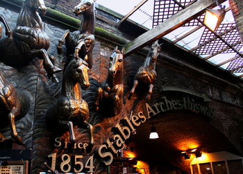 Low angle view of illuminated statue at night