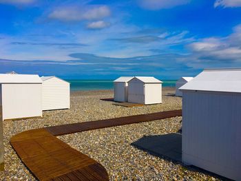 Built structure on beach against sky