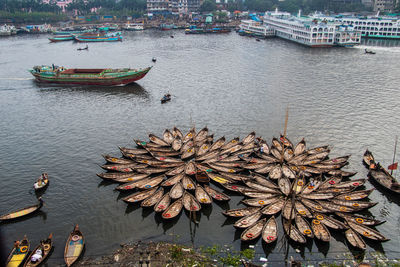 Traditional architectural wooden boat station on the riverbank 