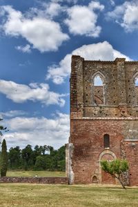 Old building against cloudy sky