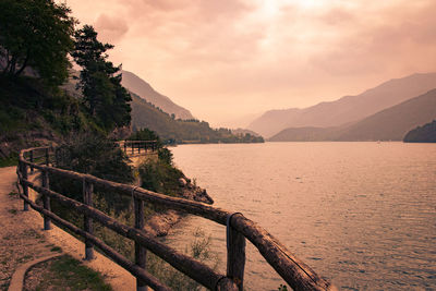 Scenic view of lake against sky during sunset