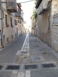 Narrow alley along buildings