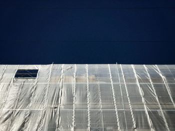 Low angle view of building against blue sky