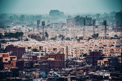 Scenic view of town against clear sky