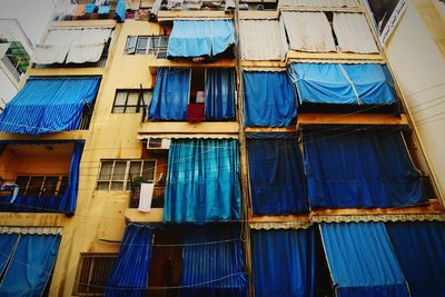 Low angle view of clothes drying on building