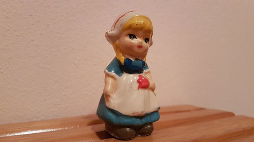 Close-up of boy on table