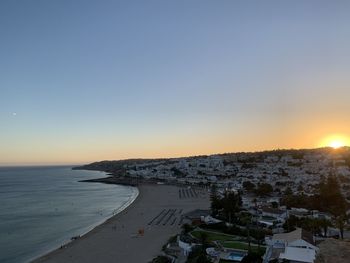 Scenic view of sea against clear sky during sunset