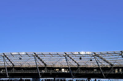 Low angle view of buildings against clear blue sky