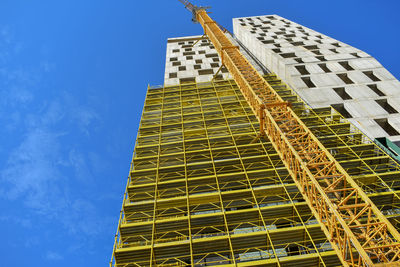 Low angle view of building against clear blue sky