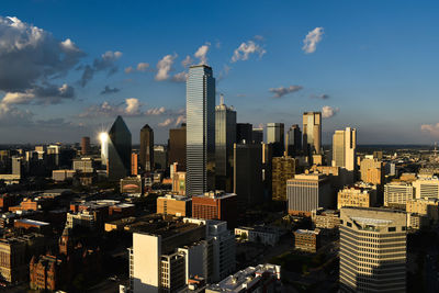 Aerial view of modern buildings against sky in city