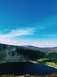 Scenic view of landscape against blue sky
